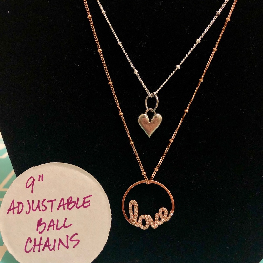 Two Origami Owl necklaces.